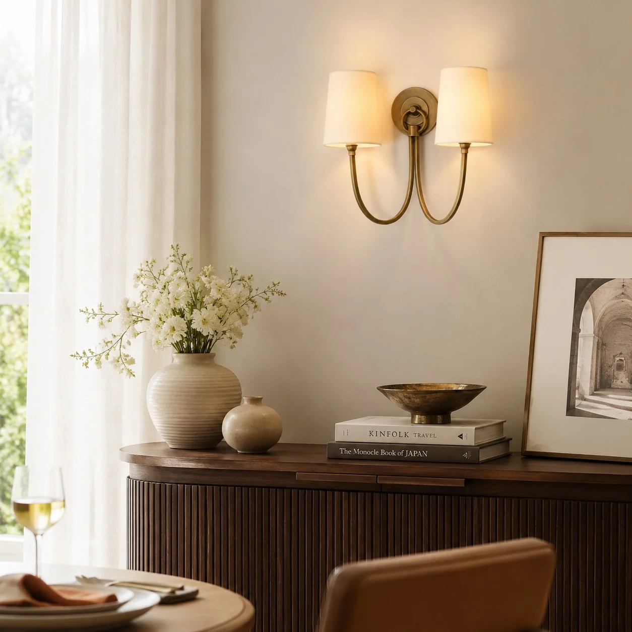 Soft linen shade on the Ananke wall sconce