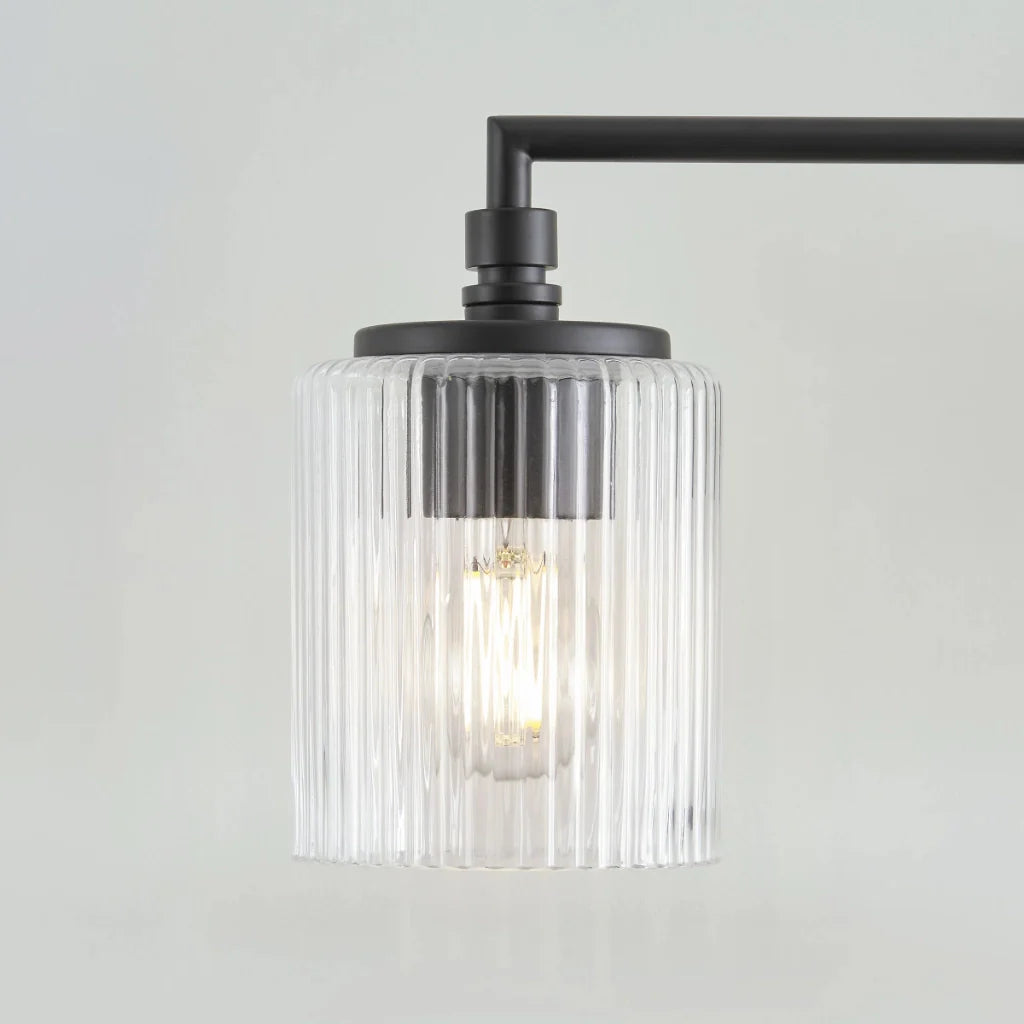 Eliot_Modern_3-Lichts_Geribbelde_Glas_Cilinder_Vanity_Wall_Lamp-xj2.webp__PID:29708bc9-7fbe-4c45-8c8a-ae626e03efda