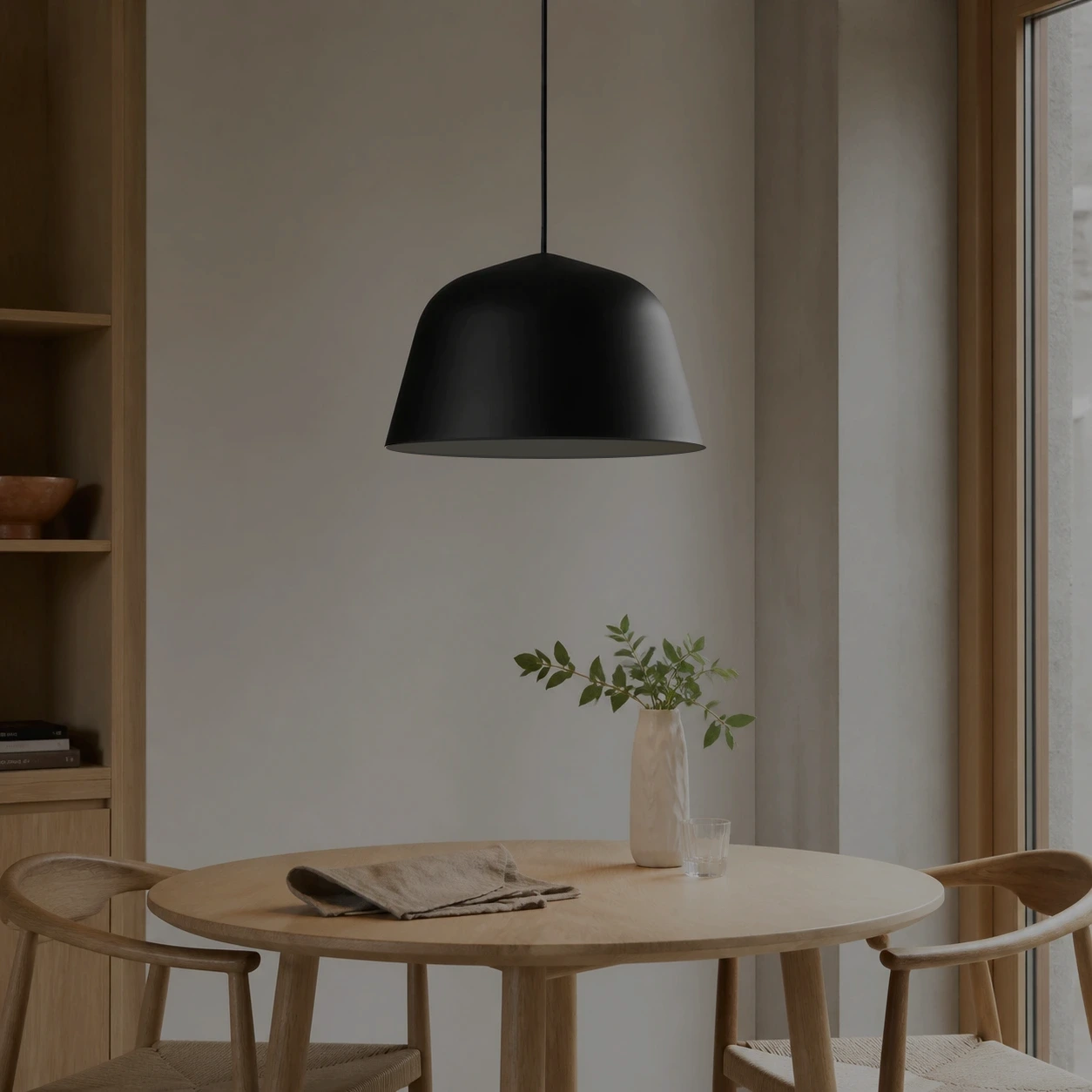 The same dining scene with the black Eros pendant switched off