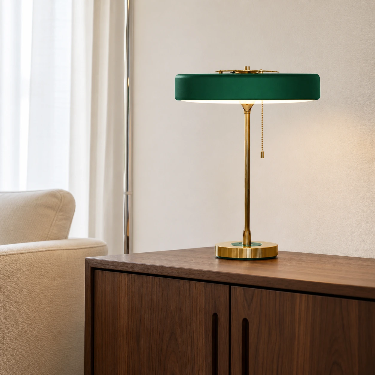 Green Revolve table lamp on a walnut sideboard in a bright living room
