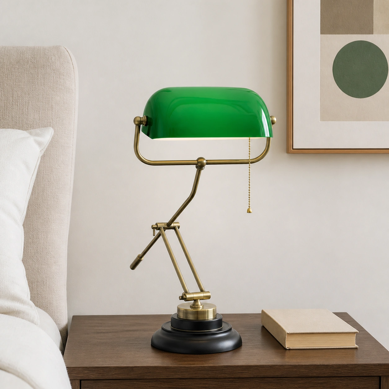 Green glass table lamp on a bedside table