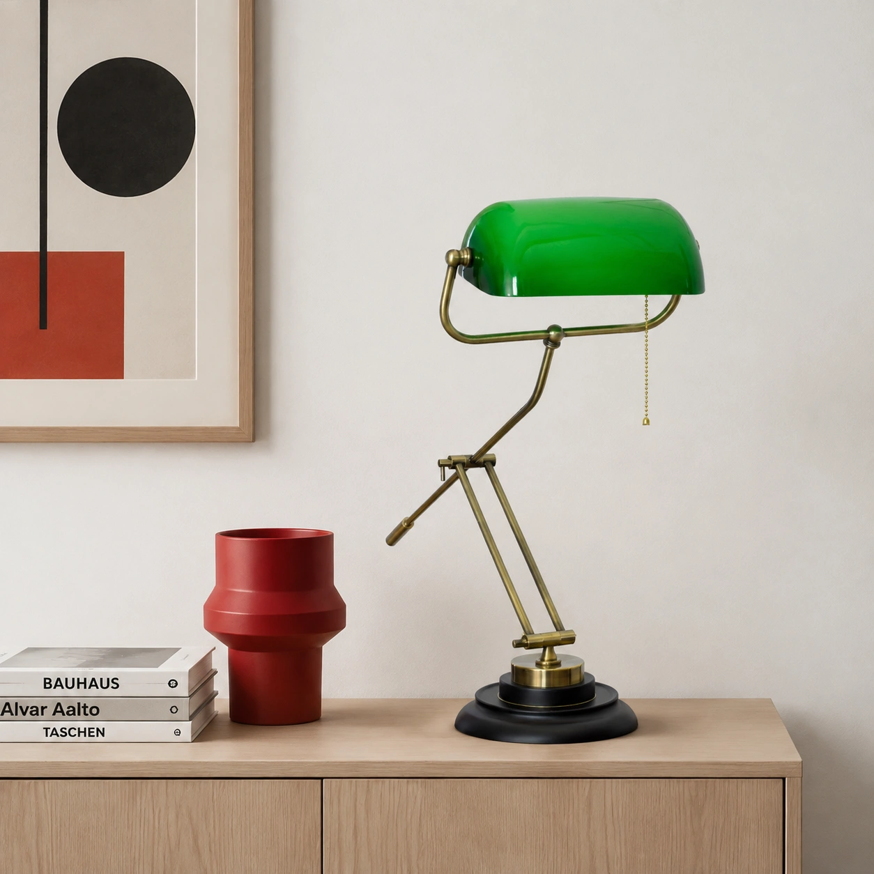 Green glass table lamp on an ash sideboard