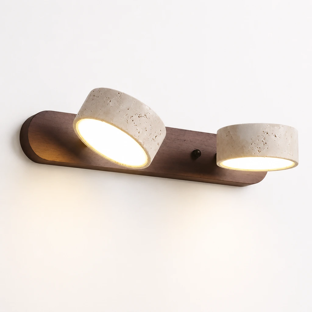 2-light wall sconce switched on against a white studio wall