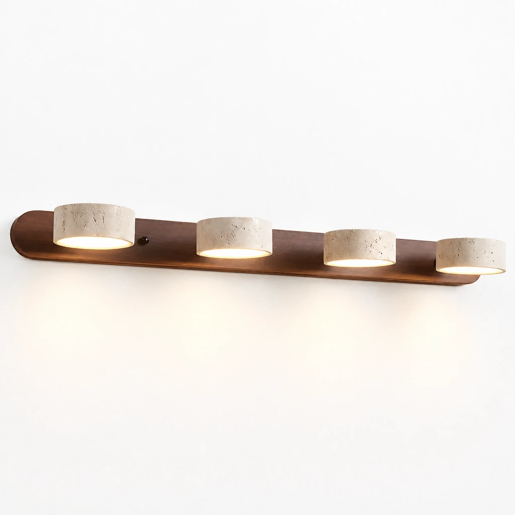 4-light wall sconce switched on against a white studio wall