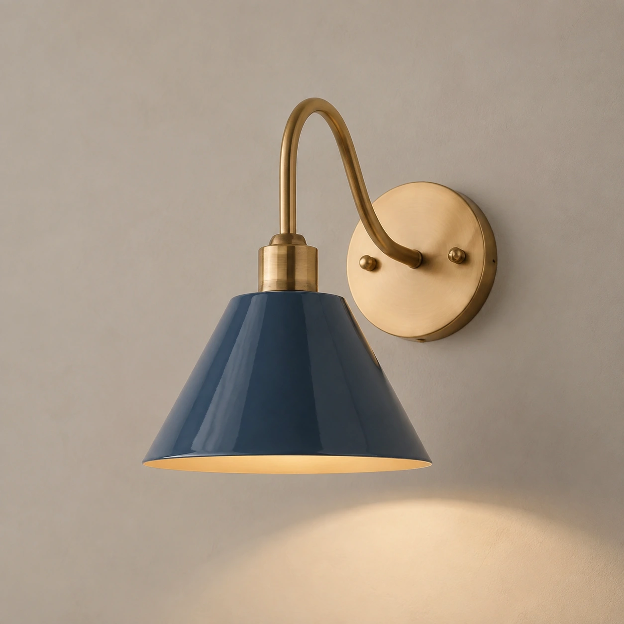 Midnight Blue Penia wall sconce on a light studio wall