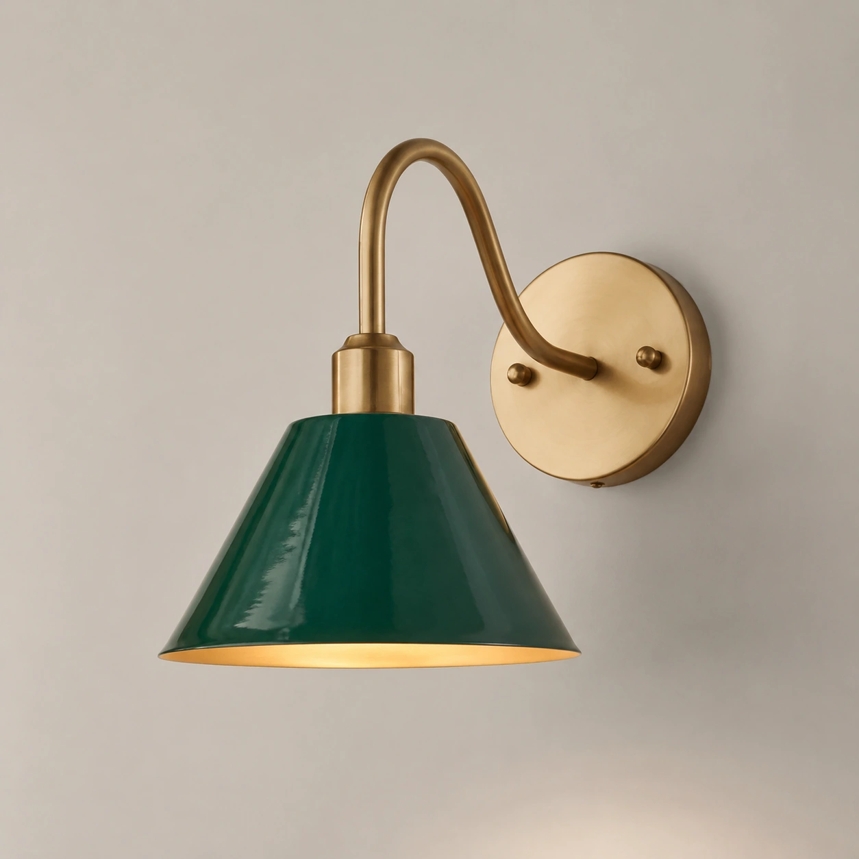 Schoolhouse Green Penia wall sconce on a light studio wall