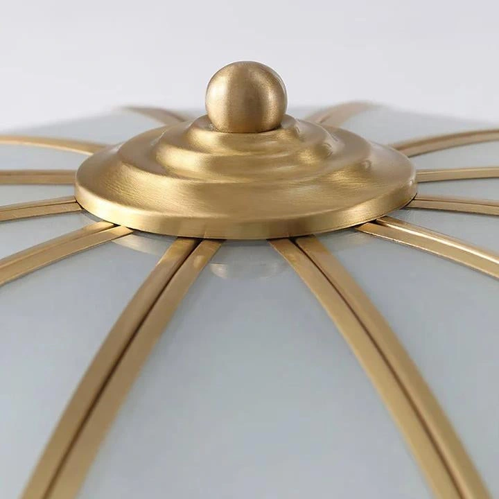 Brass-toned centre finial and radial frame detail