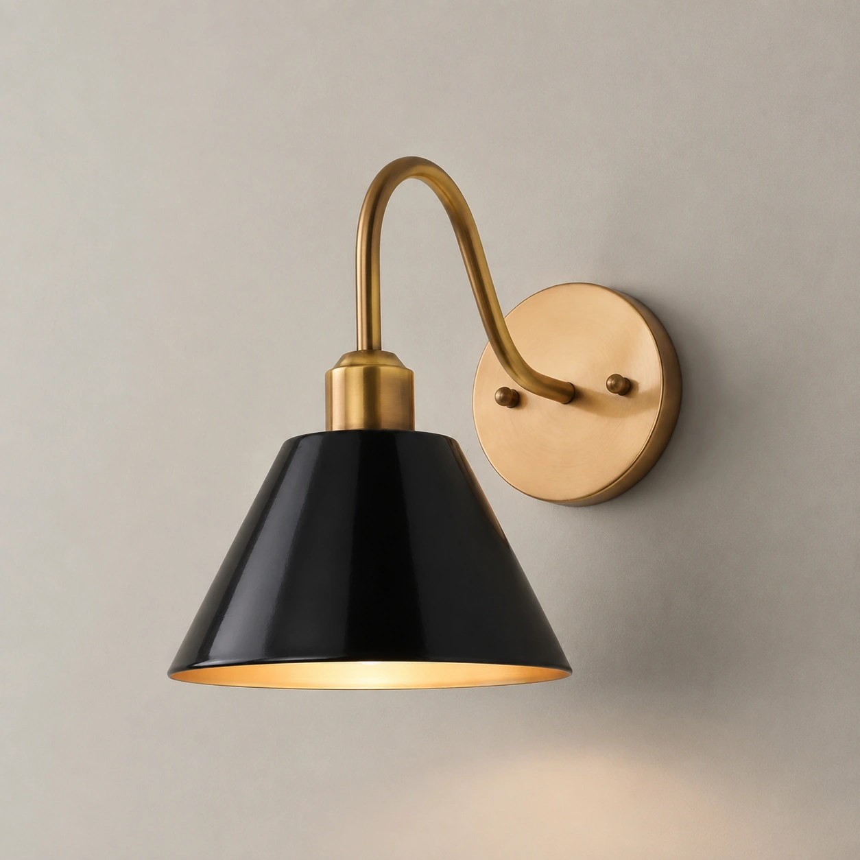 Black Penia wall sconce on a light studio wall