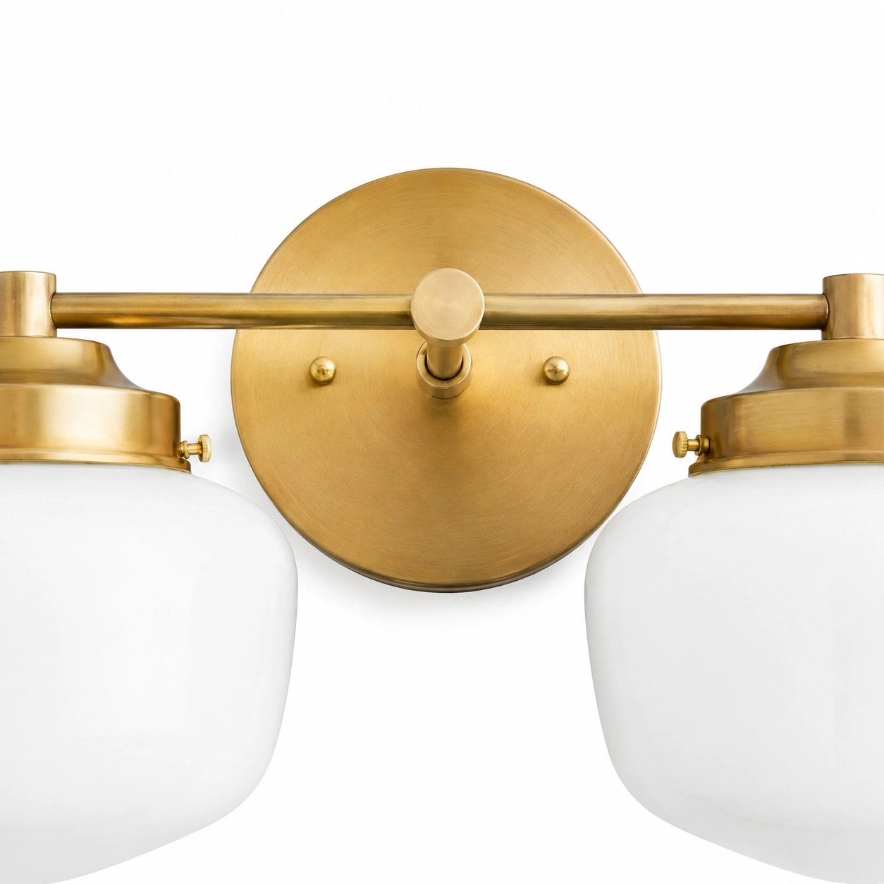 Close-up of the brass wall plate, twin rails and central finial