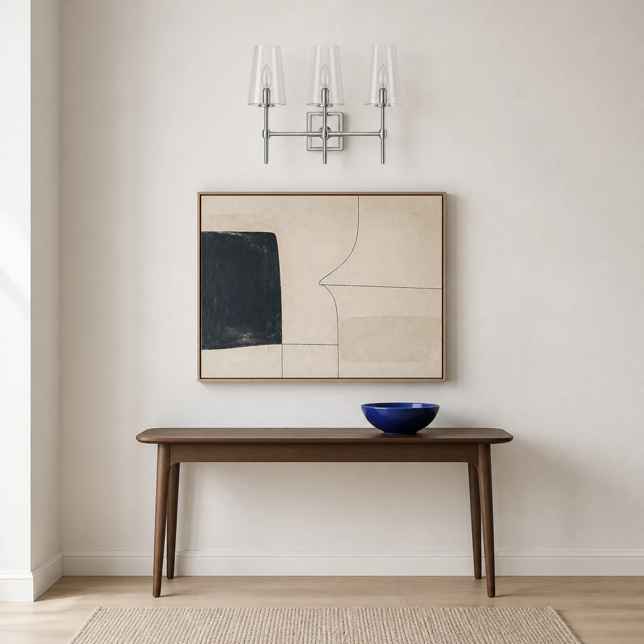 Three-head nickel Yve wall sconce in a modern entry