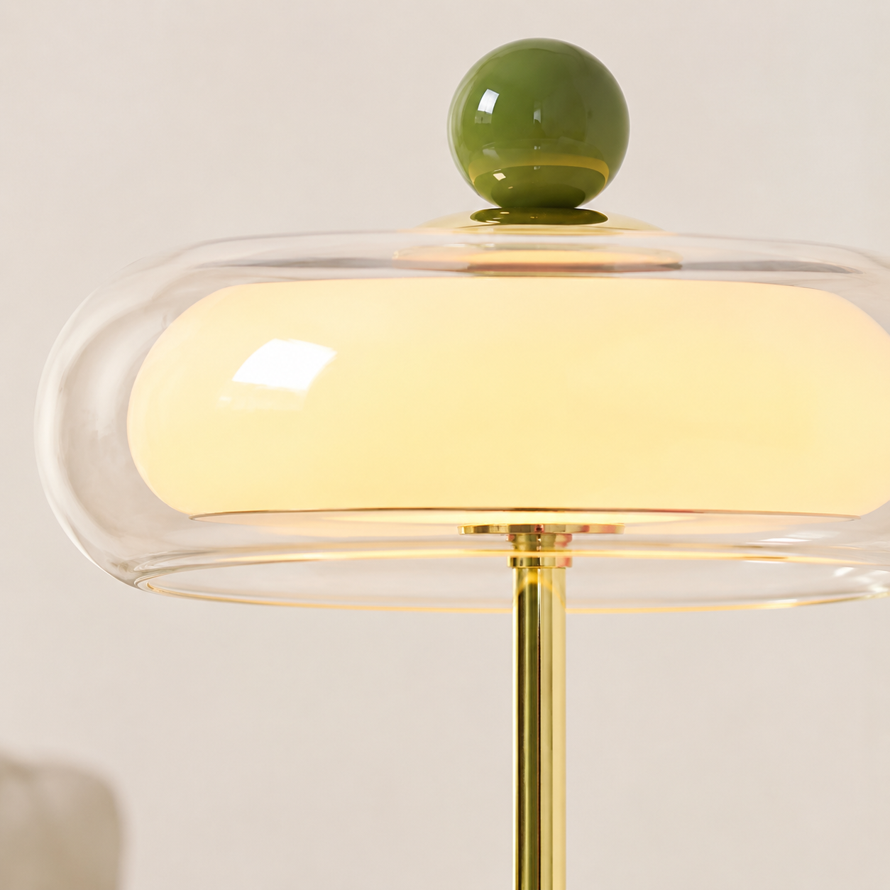 Clear glass shade and polished gold stem detail