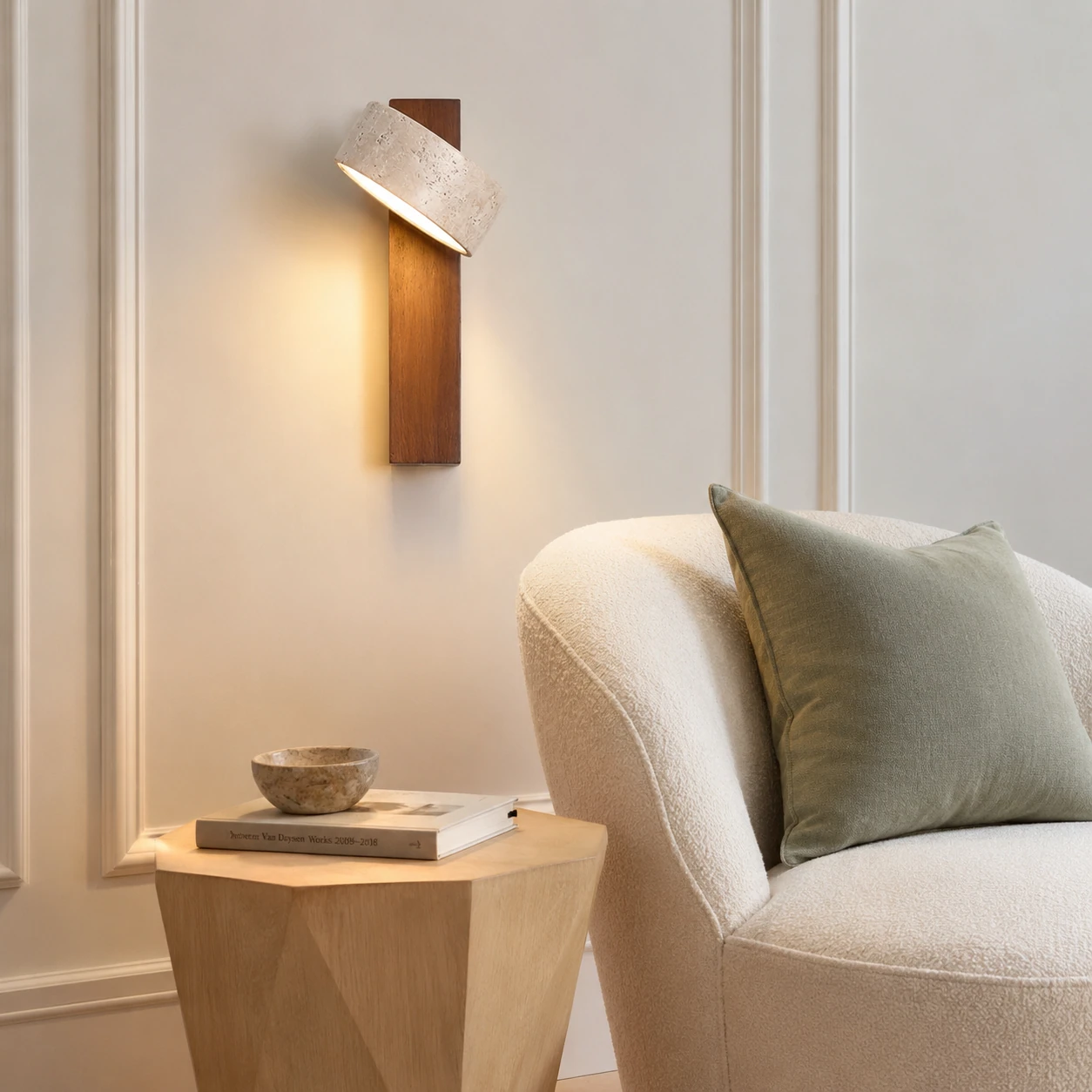 Adjustable light wood sconce angled toward a reading table