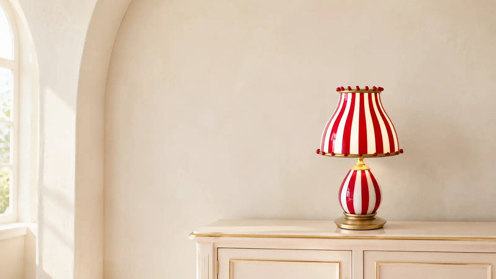 Odette striped table lamp fully visible on an ivory console