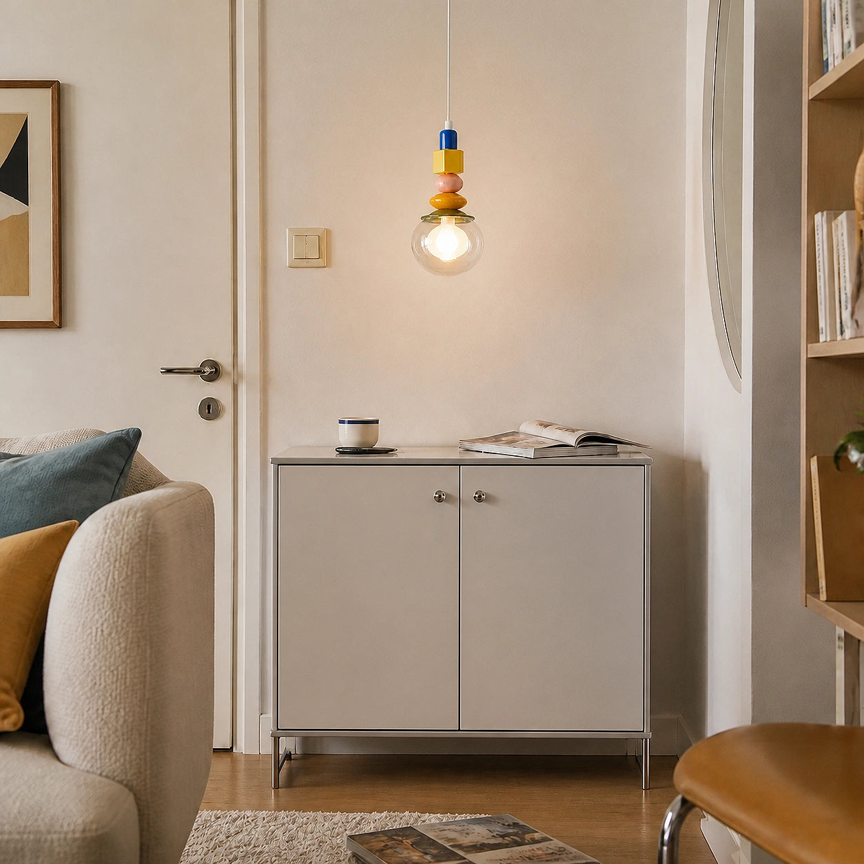 Orla clear glass pendant switched on in a bright room
