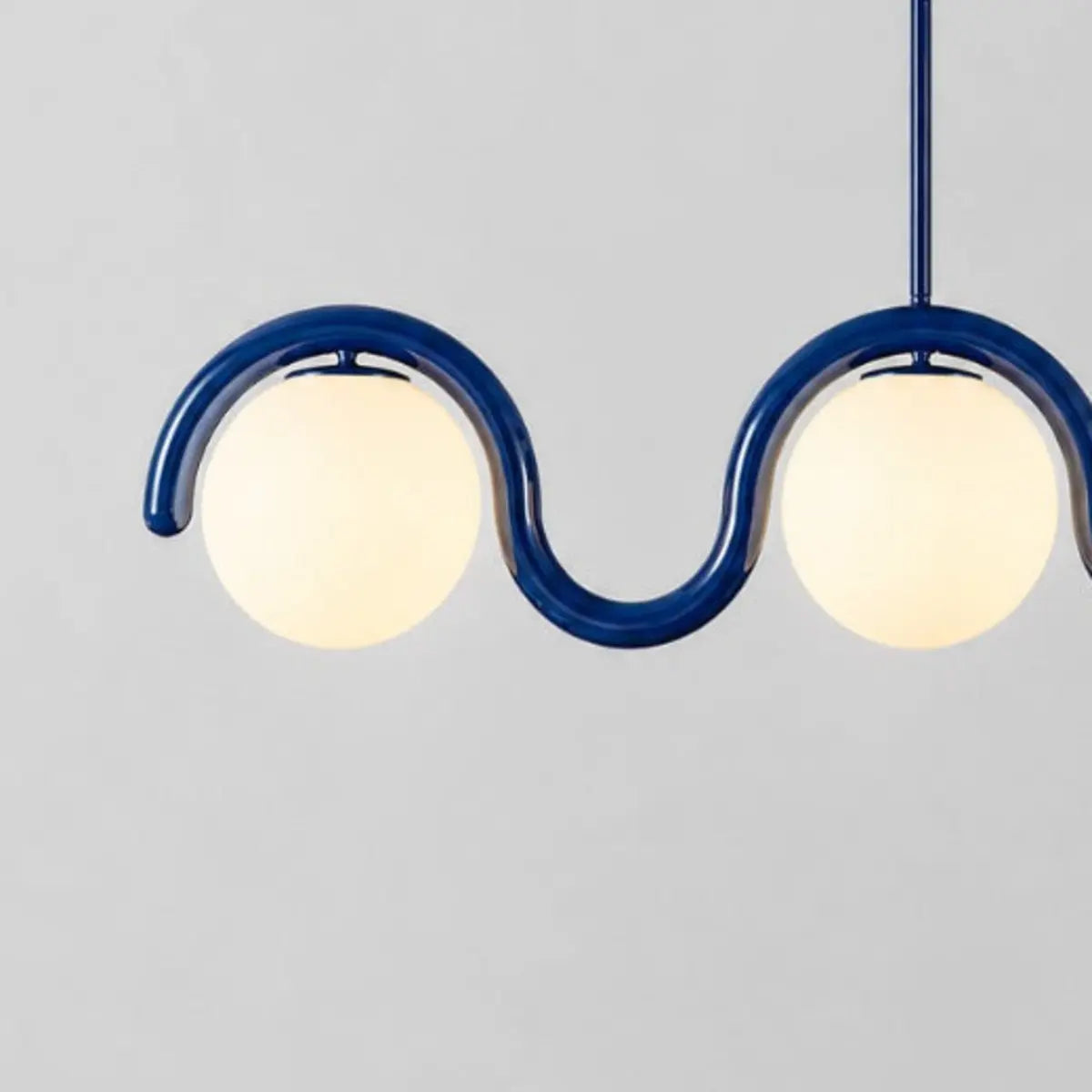 Auden blue wave chandelier rounded end and opal globe spacing detail
