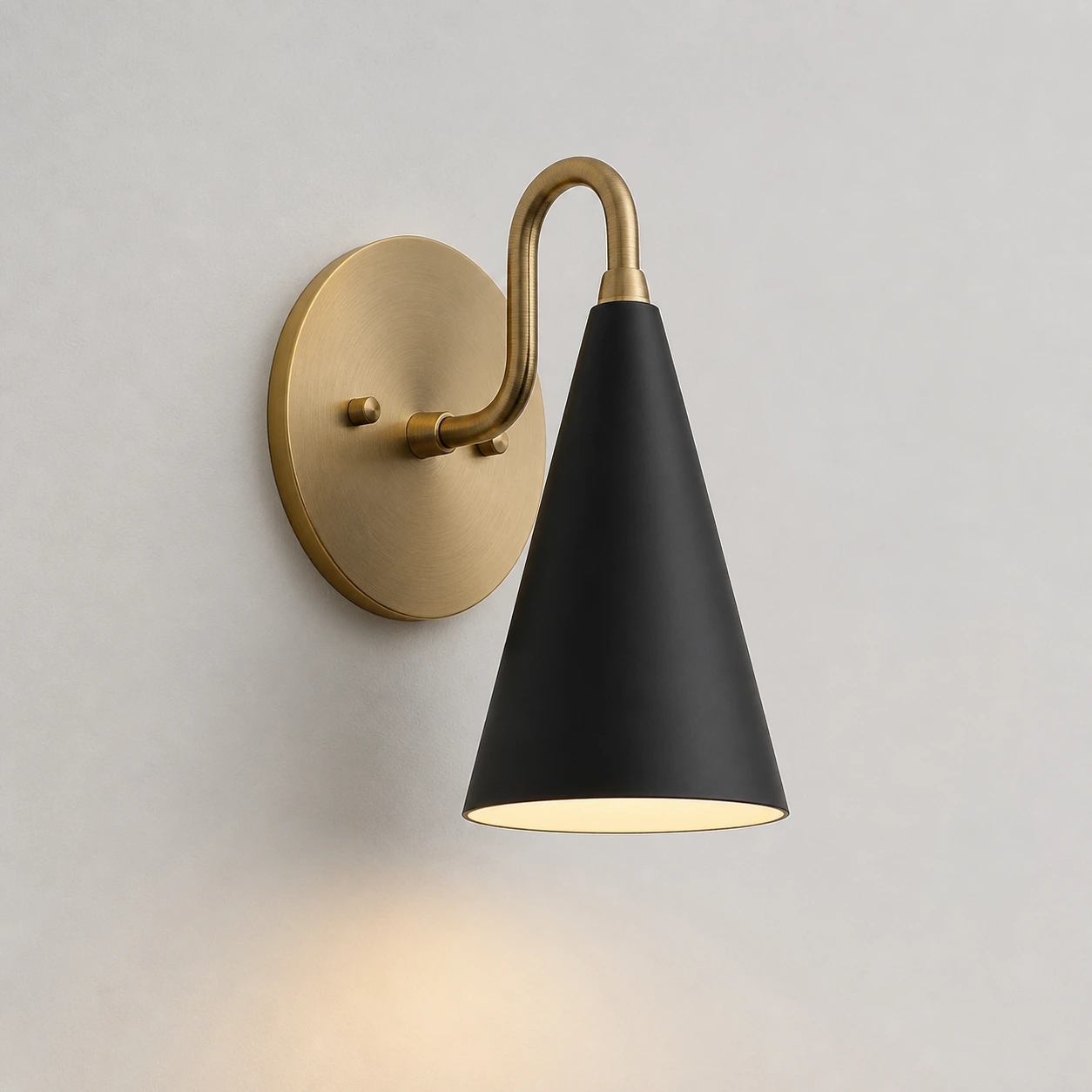 Black / Sealed Brass wall sconce switched on