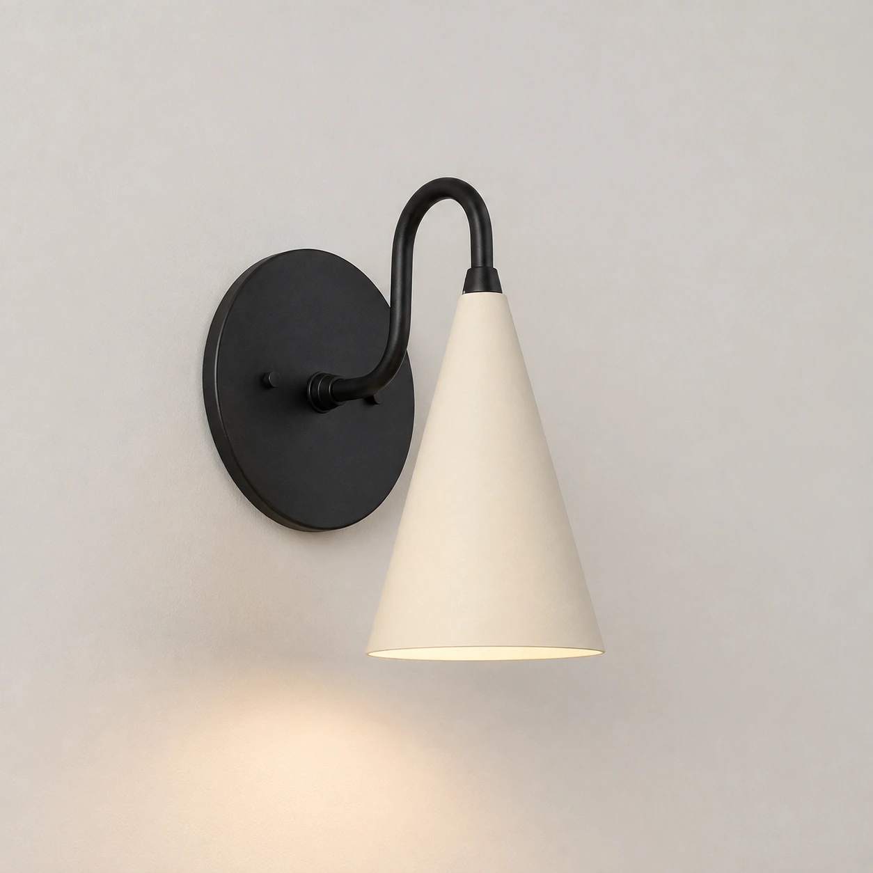 Cream / Black wall sconce switched on