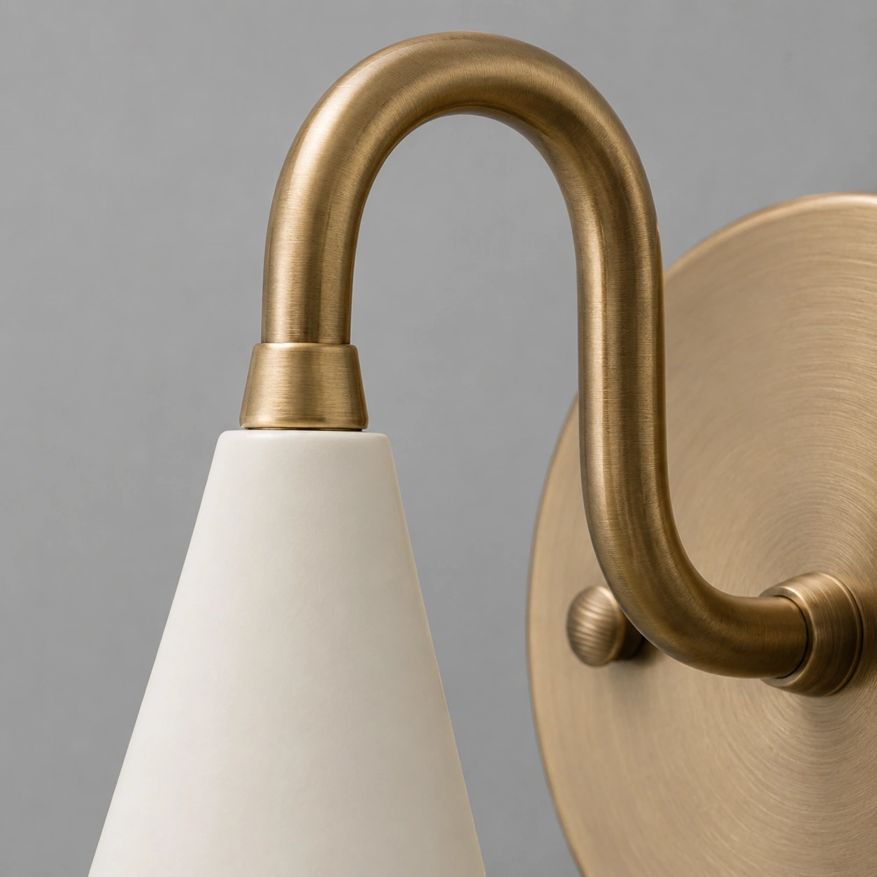 Close detail of antique brass curved arm