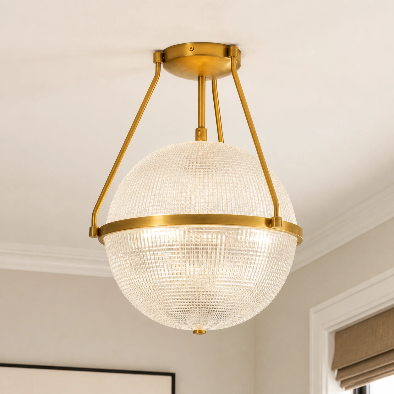Close view of gold Sven ceiling light