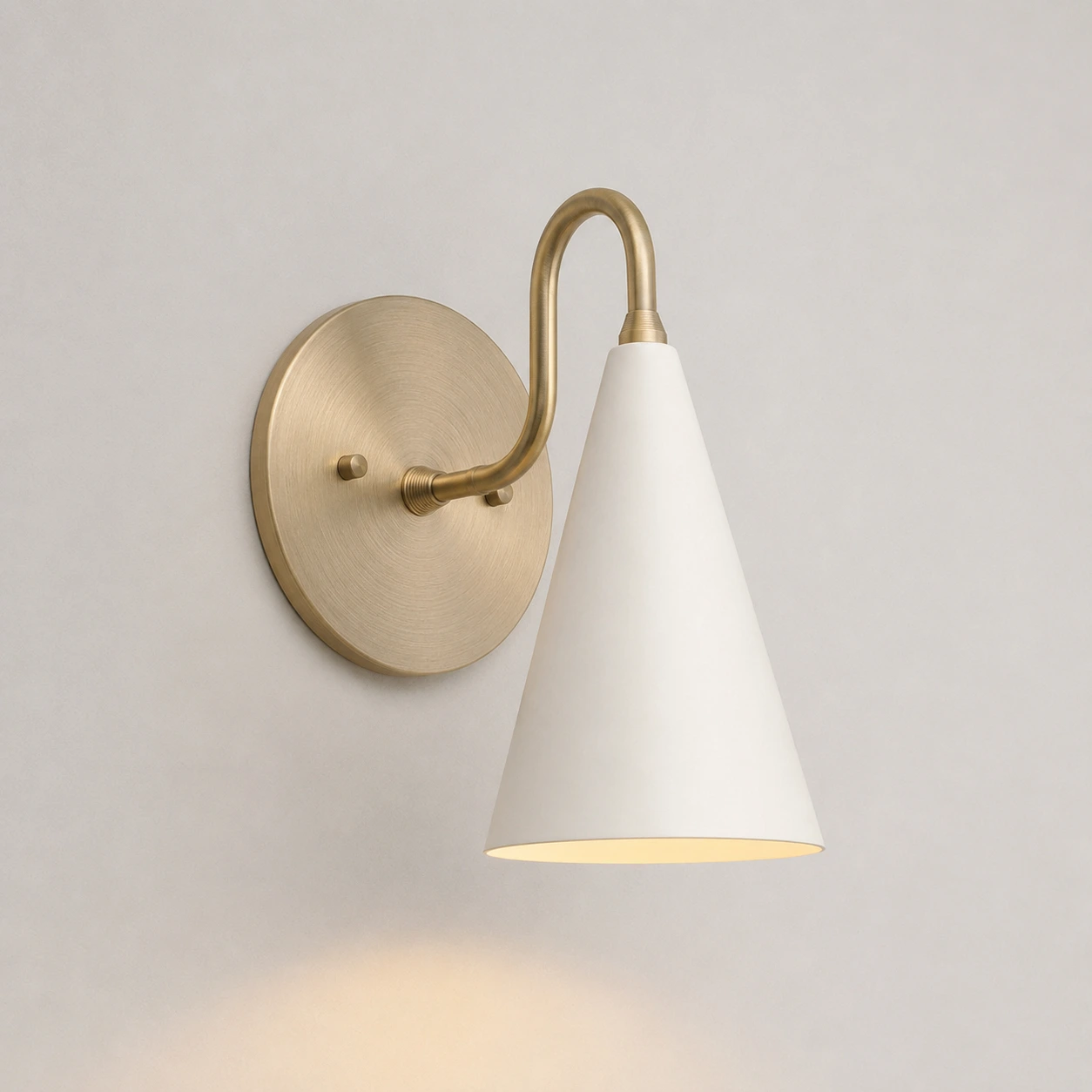 White / Antique Brass wall sconce switched on