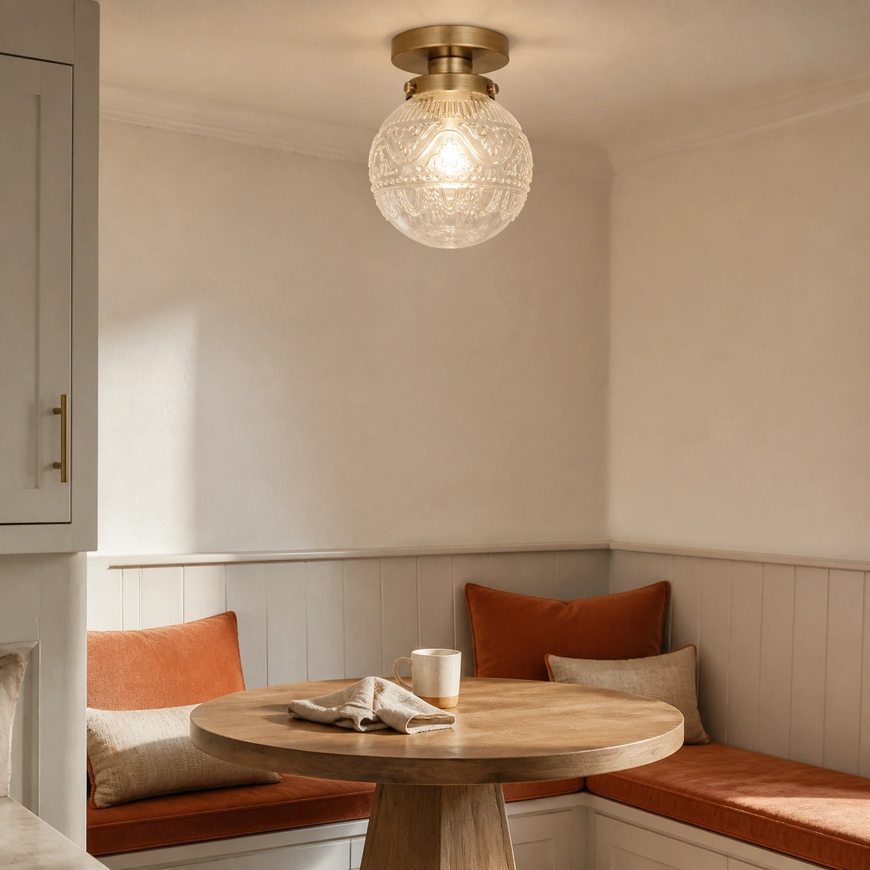 Banquette scene, clear glass and brass