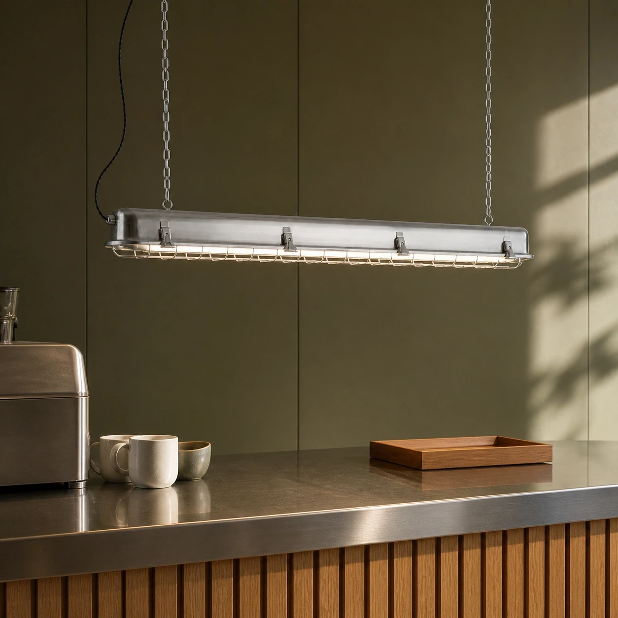 Birgit pendant above a modern cafe work counter