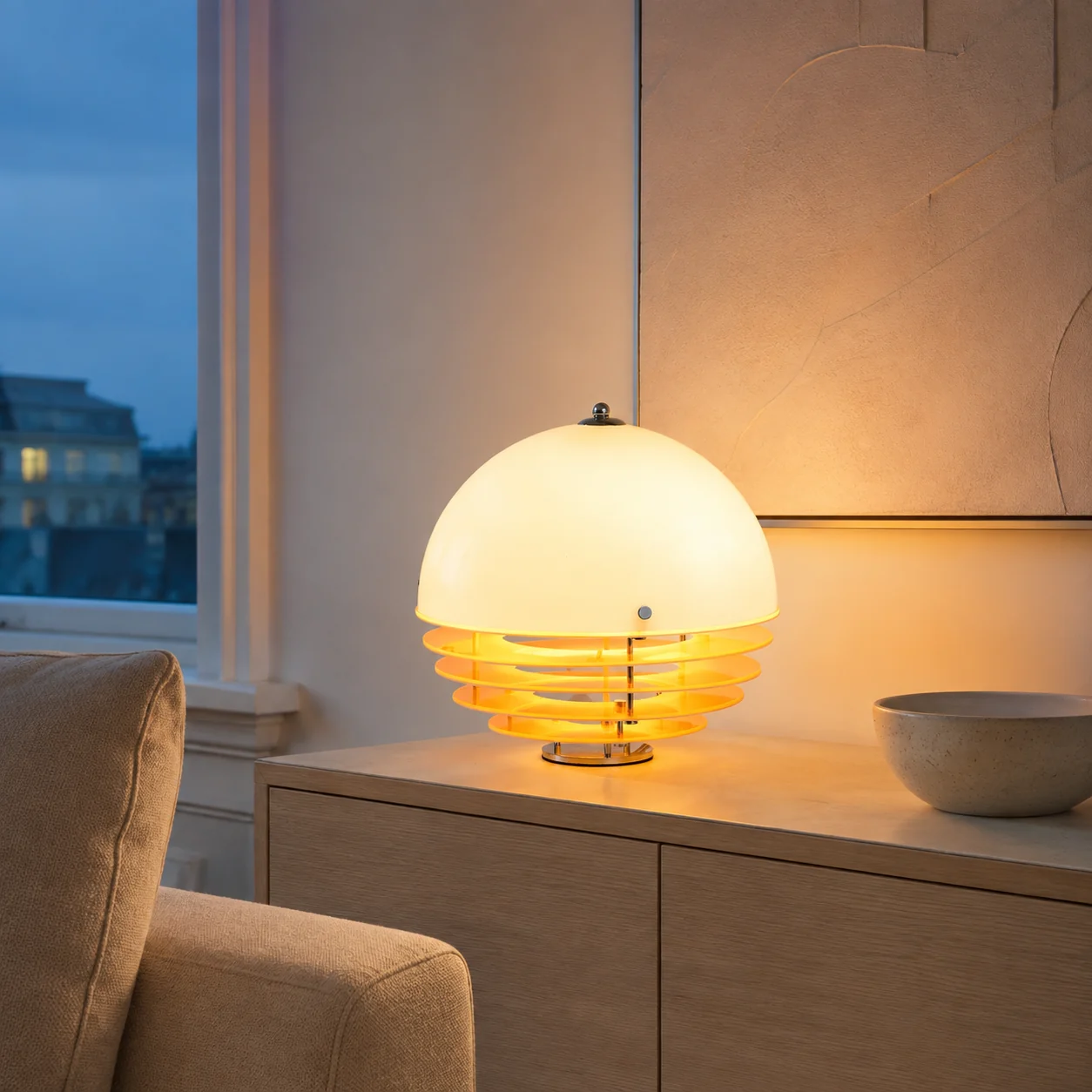 Harold lamp on a living room storage sideboard at blue hour