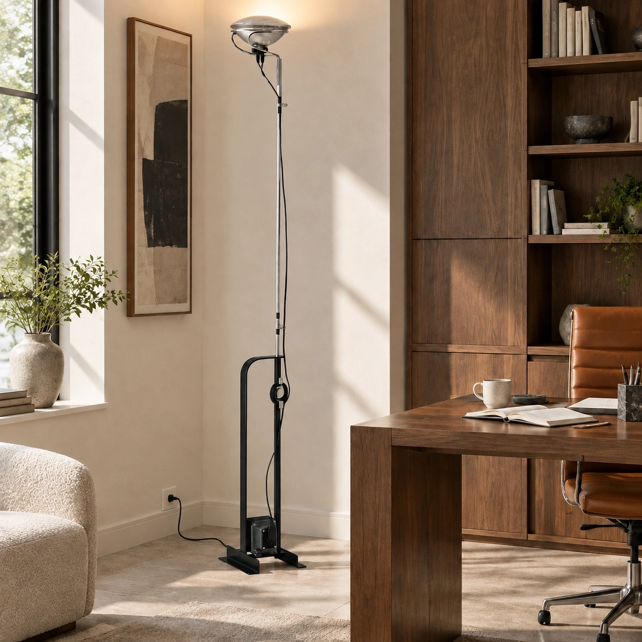 Dieter Toio black floor lamp beside a desk