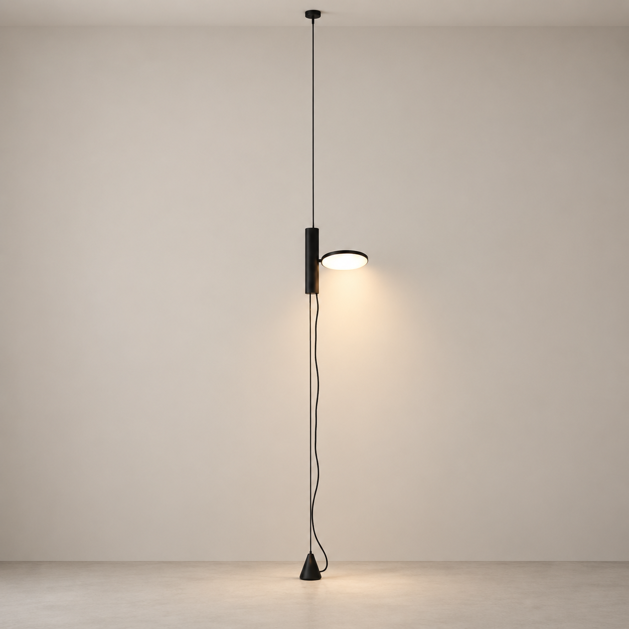 Black Dieter floor lamp switched on in a minimal studio