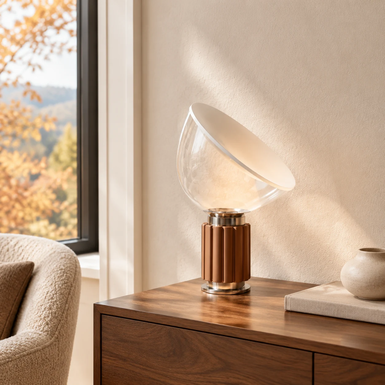 Bronze Taci table lamp beside a window in autumn