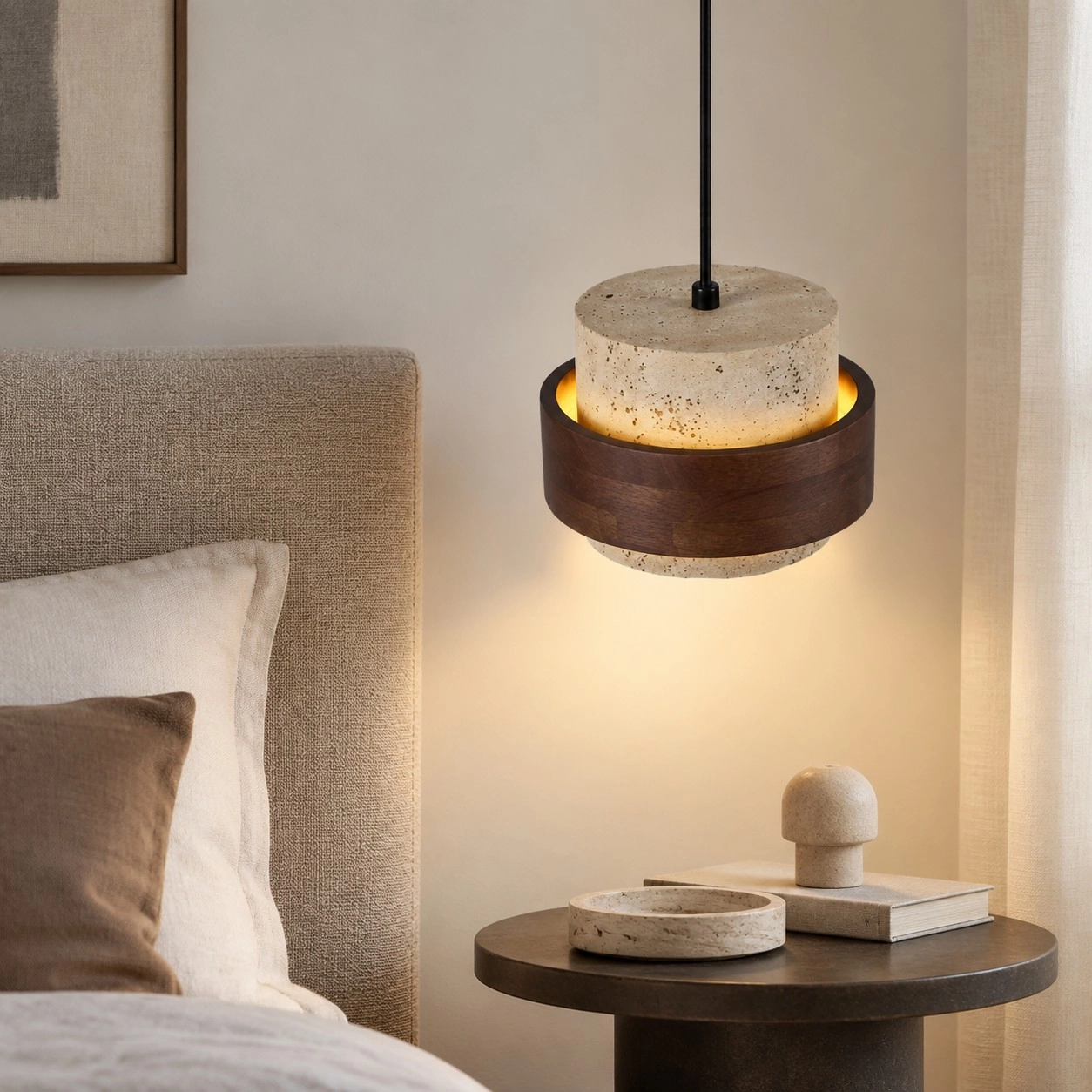Single natural travertine pendant beside a calm bedroom reading corner