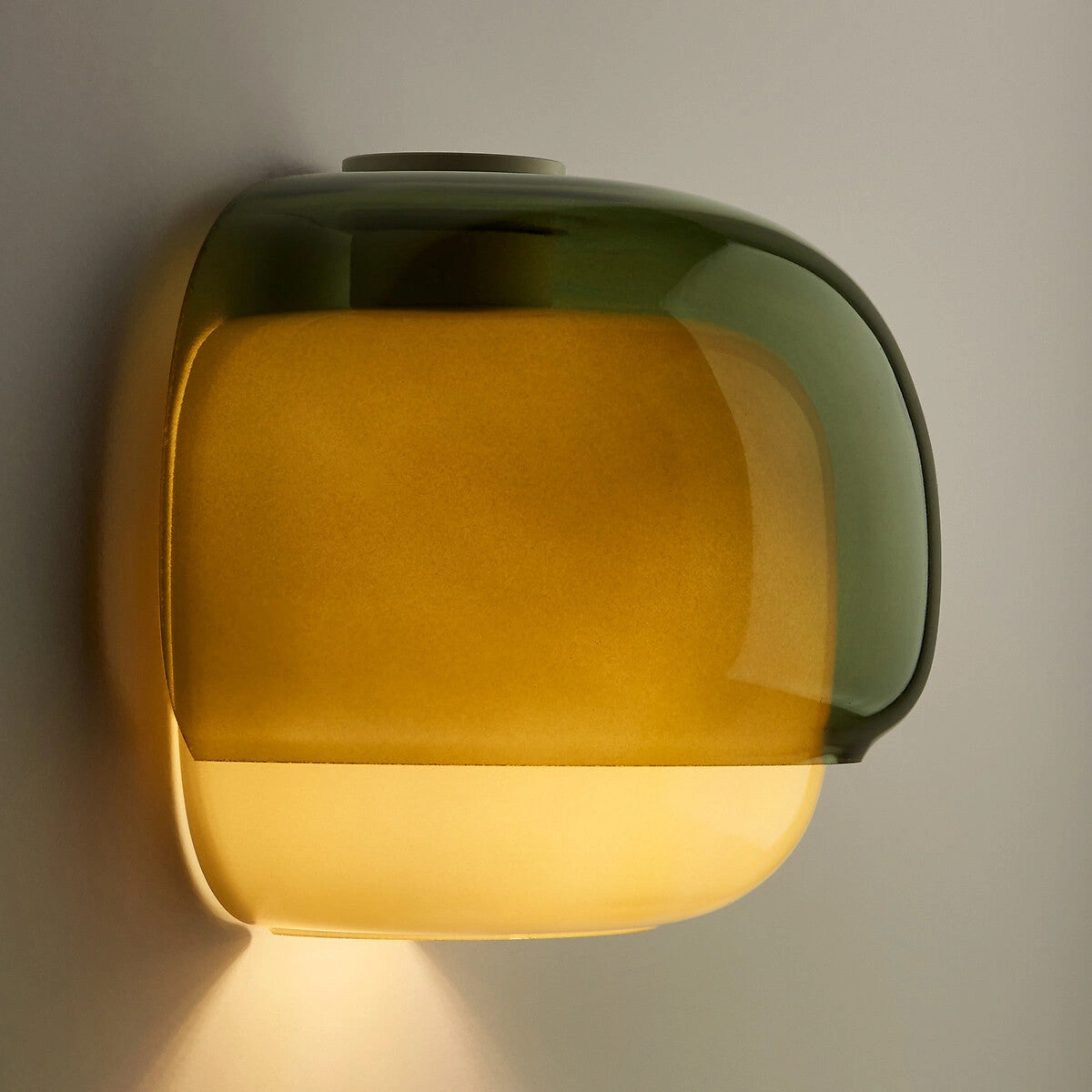 Green Sullivan wall sconce switched on