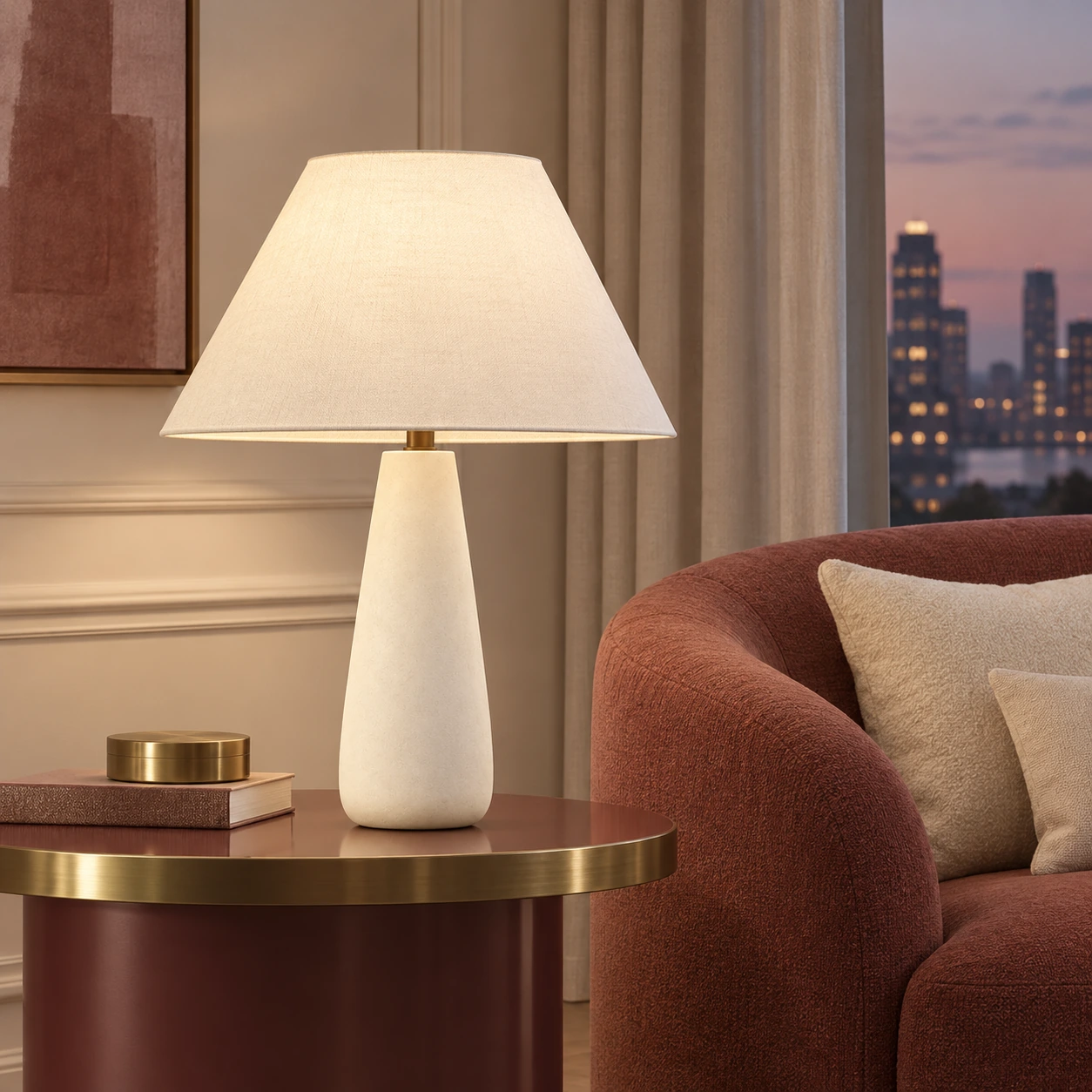 Modern tapered table lamp beside a muted burgundy sofa