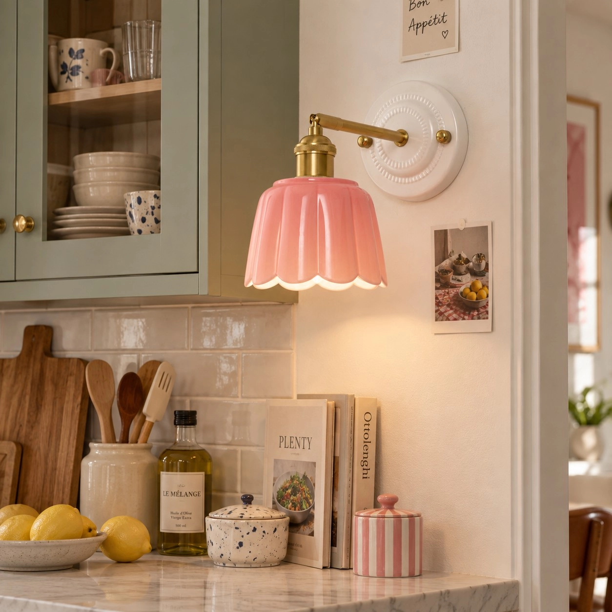 Pink wall light in a fresh sage colour setting