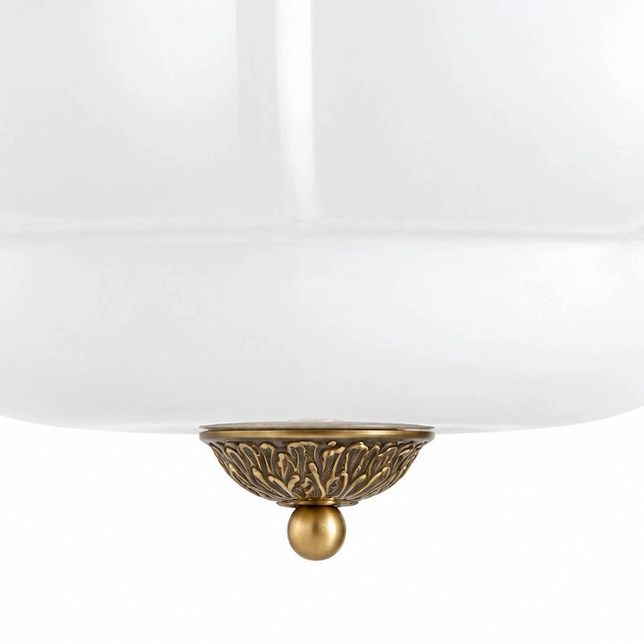 Milk glass and brass lower finial detail