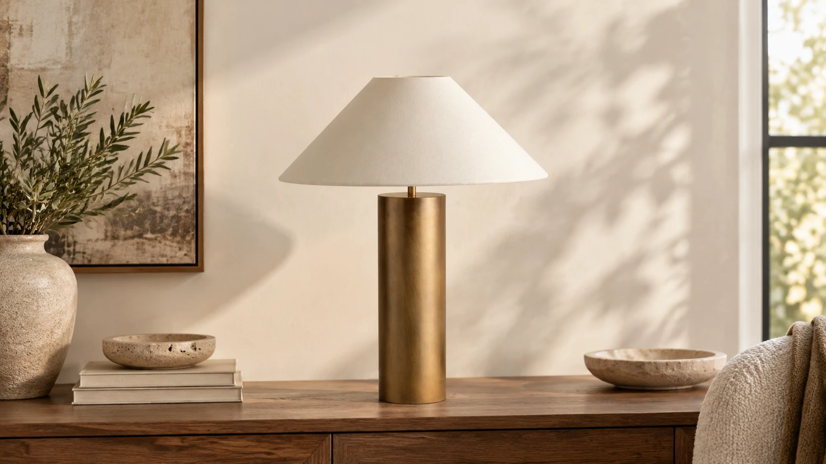 Bleeker aged brass and linen table lamp in a refined interior setting