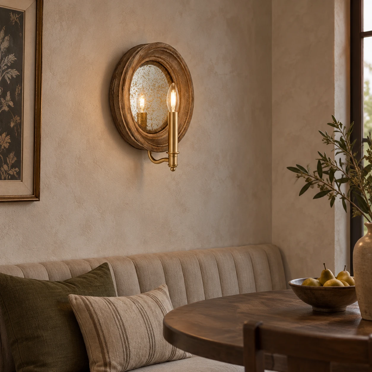 Carved wood mirror wall sconce in a dining nook