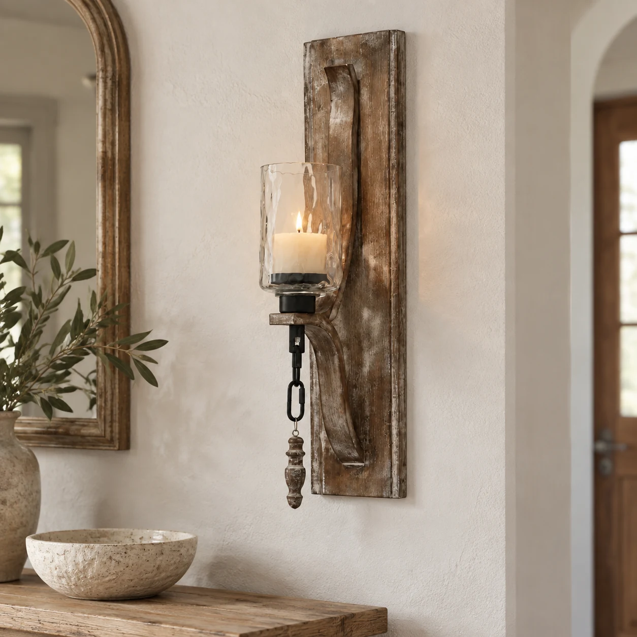 Elowen vintage carved wood candle holder viewed nearly front-on in a bright entryway