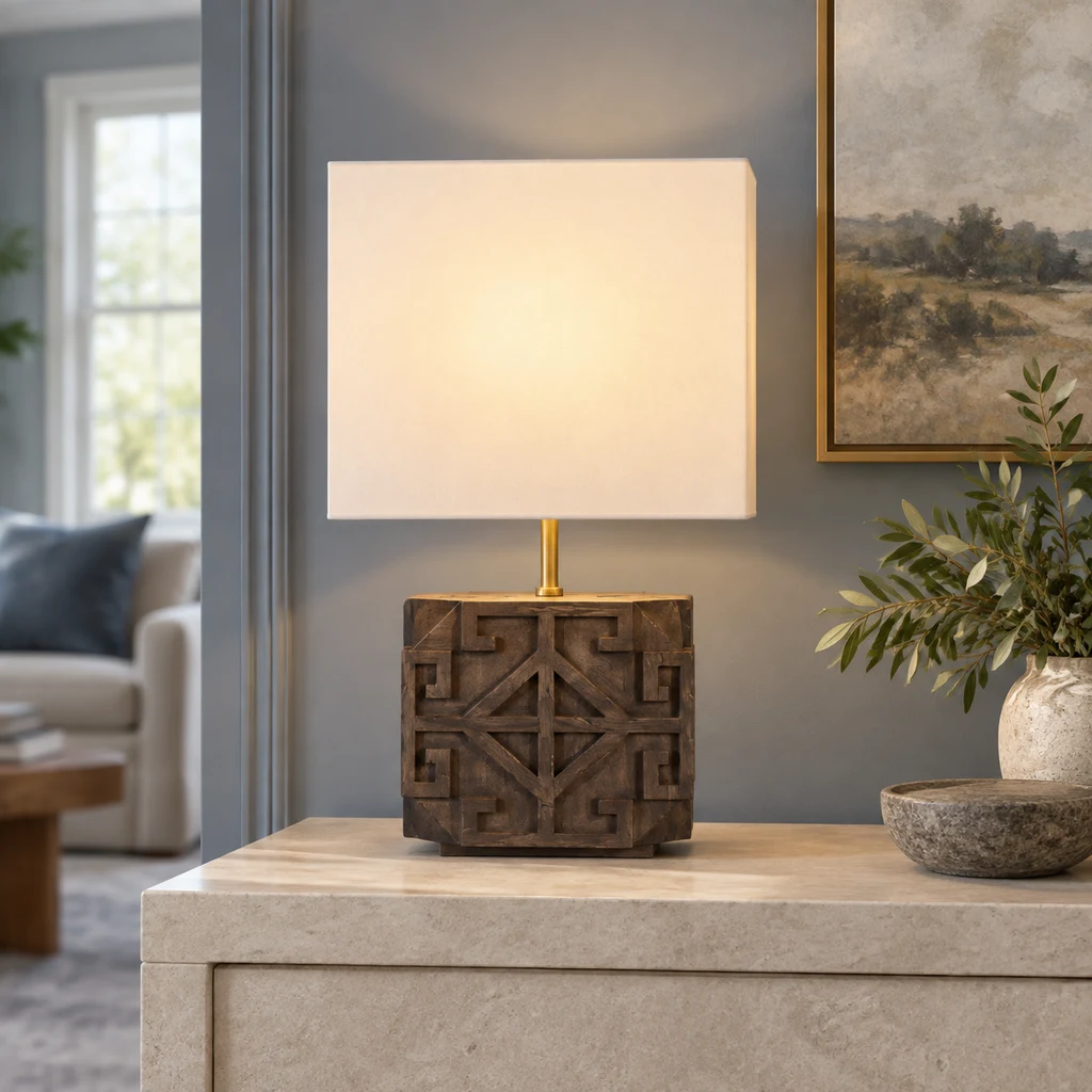 Aurelia table lamp on a pale stone console in a blue-gray living room