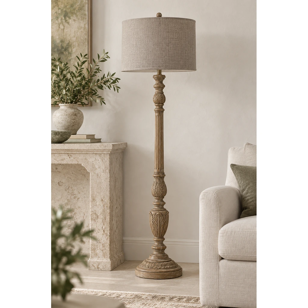 Merritt carved wood floor lamp beside a pale limestone console