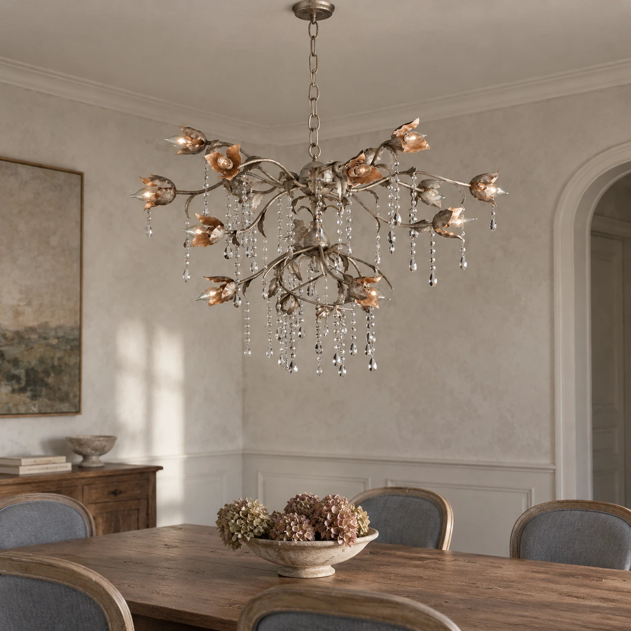Distressed silver branching crystal chandelier in an entry sitting alcove