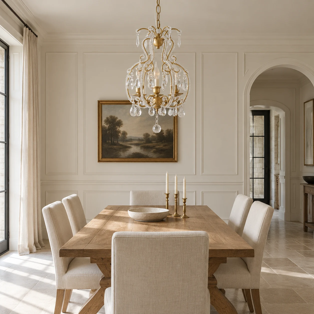 Large gold crystal chandelier over a dining table