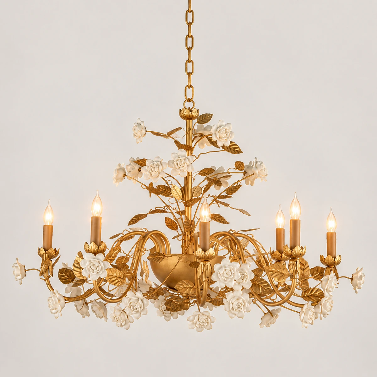 Elara floral ceramic chandelier illuminated in a neutral studio
