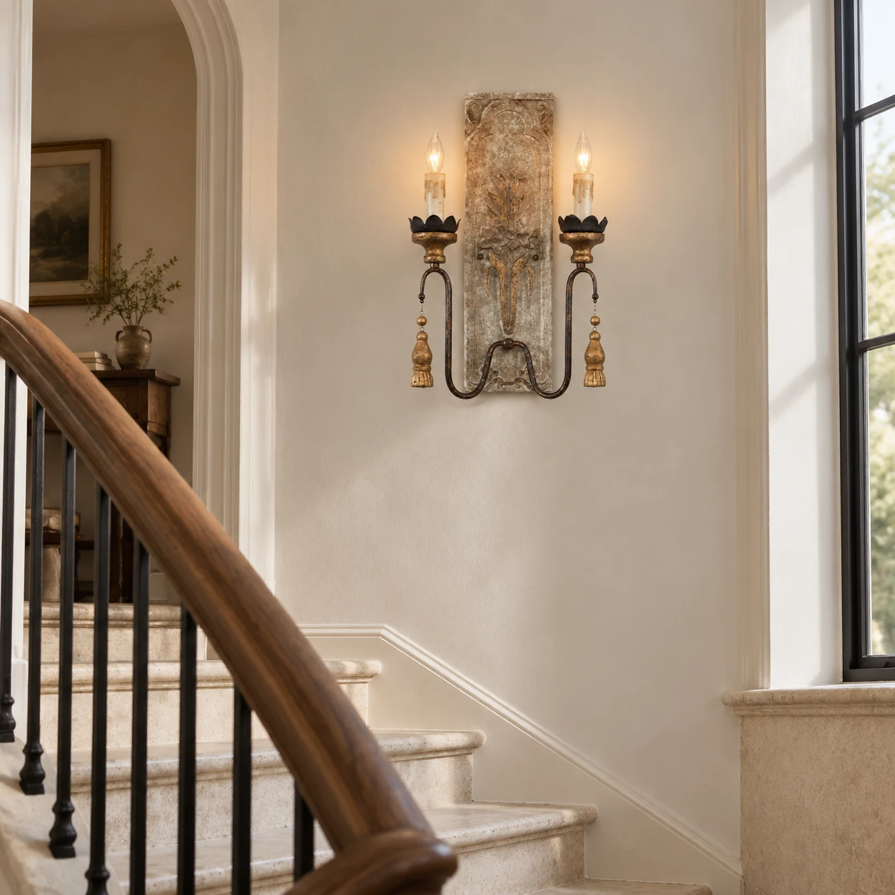 Camille French country carved-wood wall sconce in a stair landing