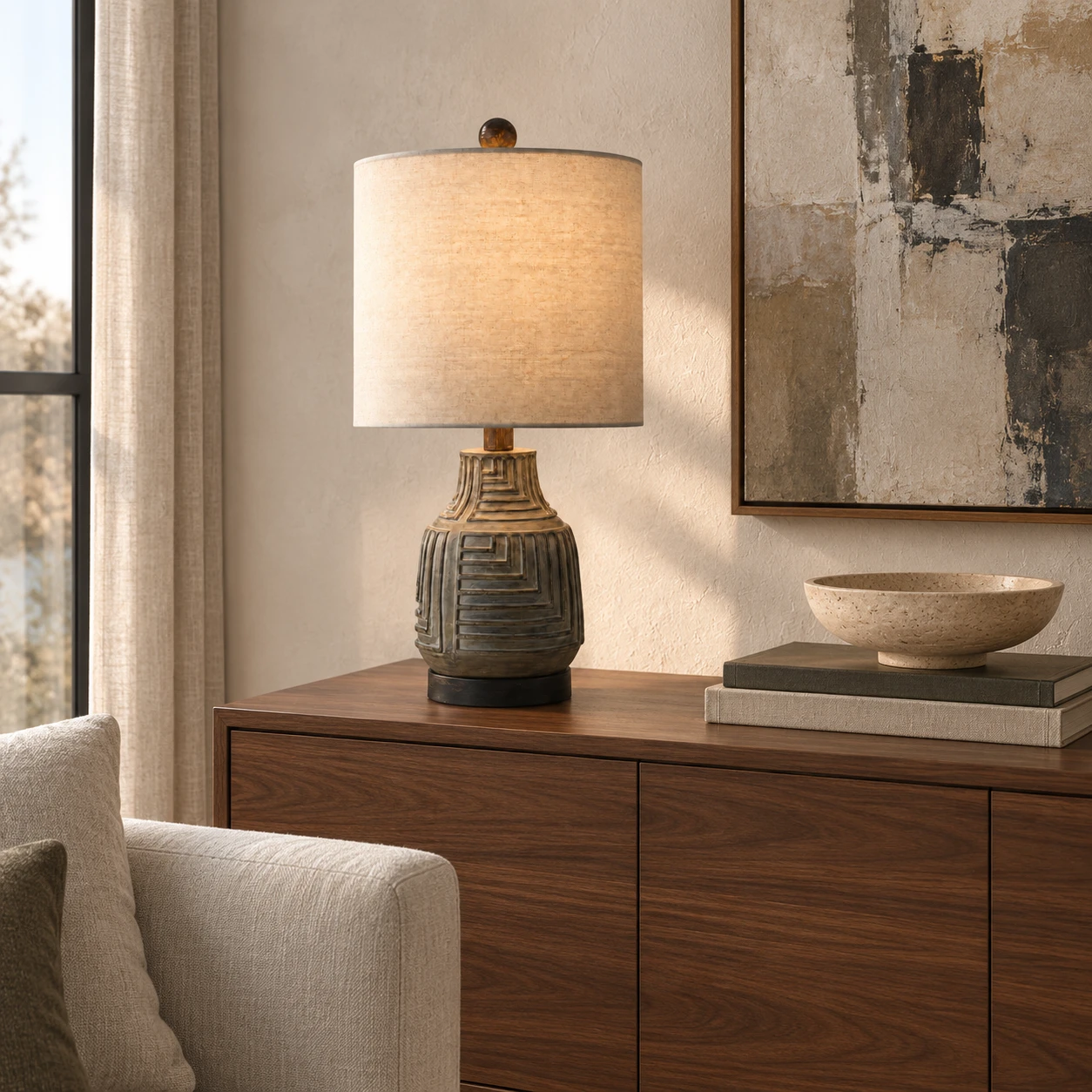 Carved wood table lamp on a living room sideboard