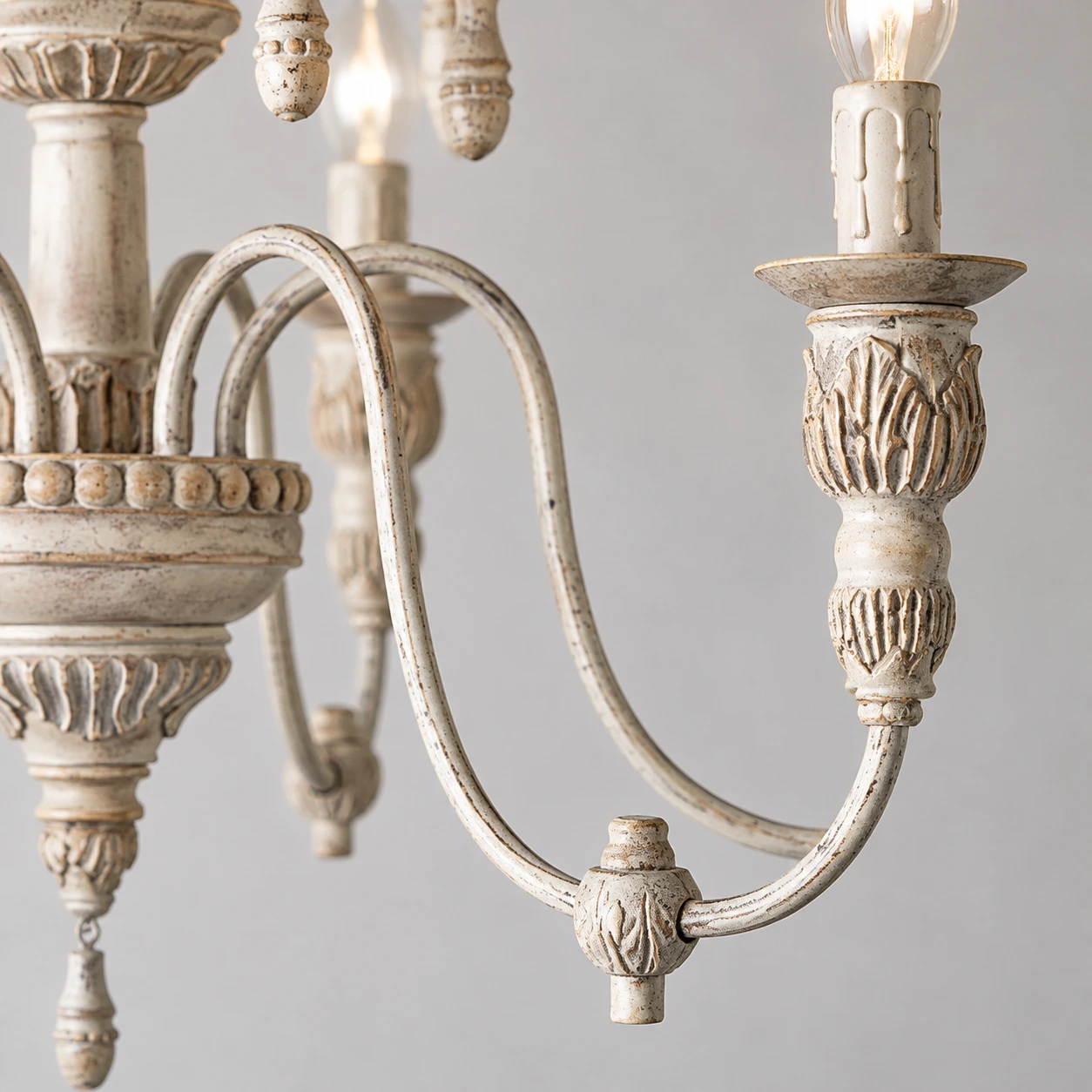 Maribel Rustic Carved Wood-Look Chandelier — shared gallery/body metal arm detail