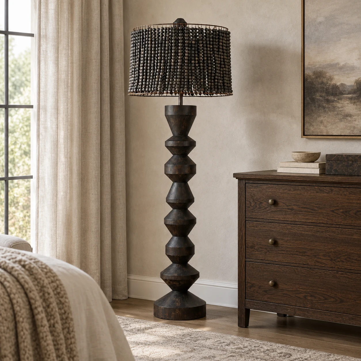 Dark wood beaded floor lamp beside a dresser