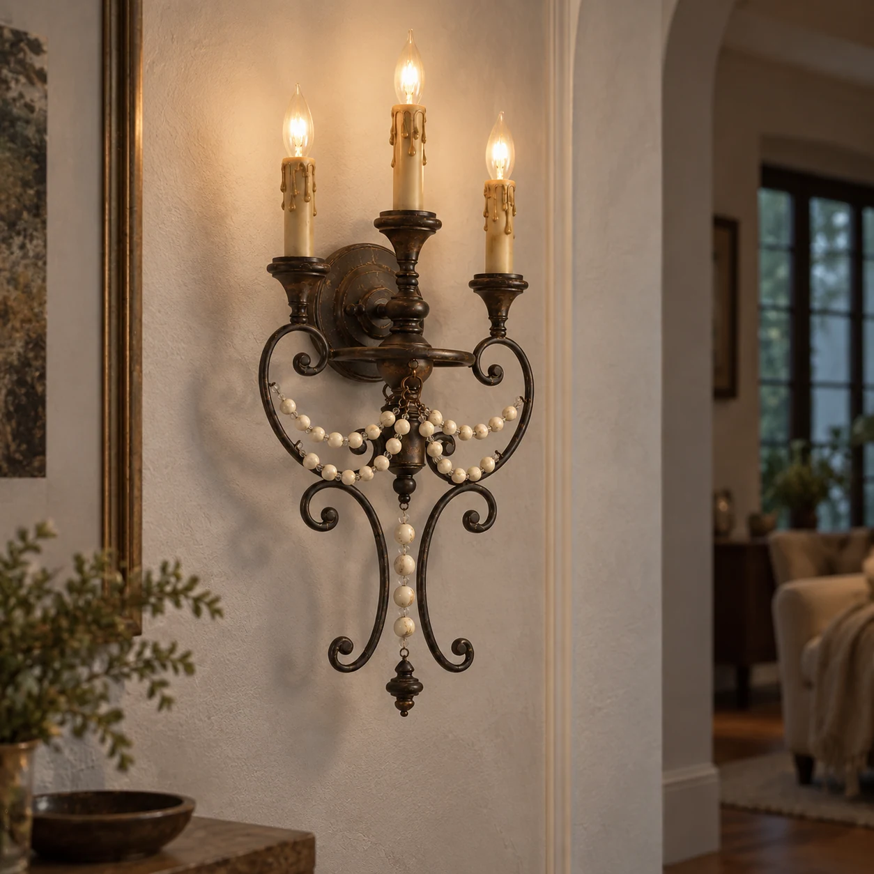 Antique three-light beaded wall sconce, residential installation scene