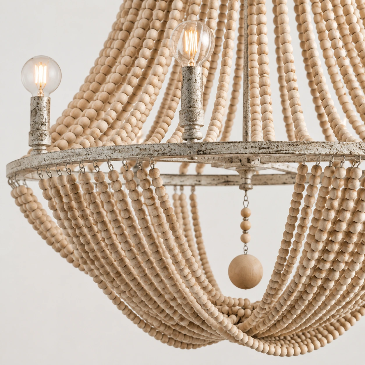 Close detail of the handwoven wood bead drape and central drop