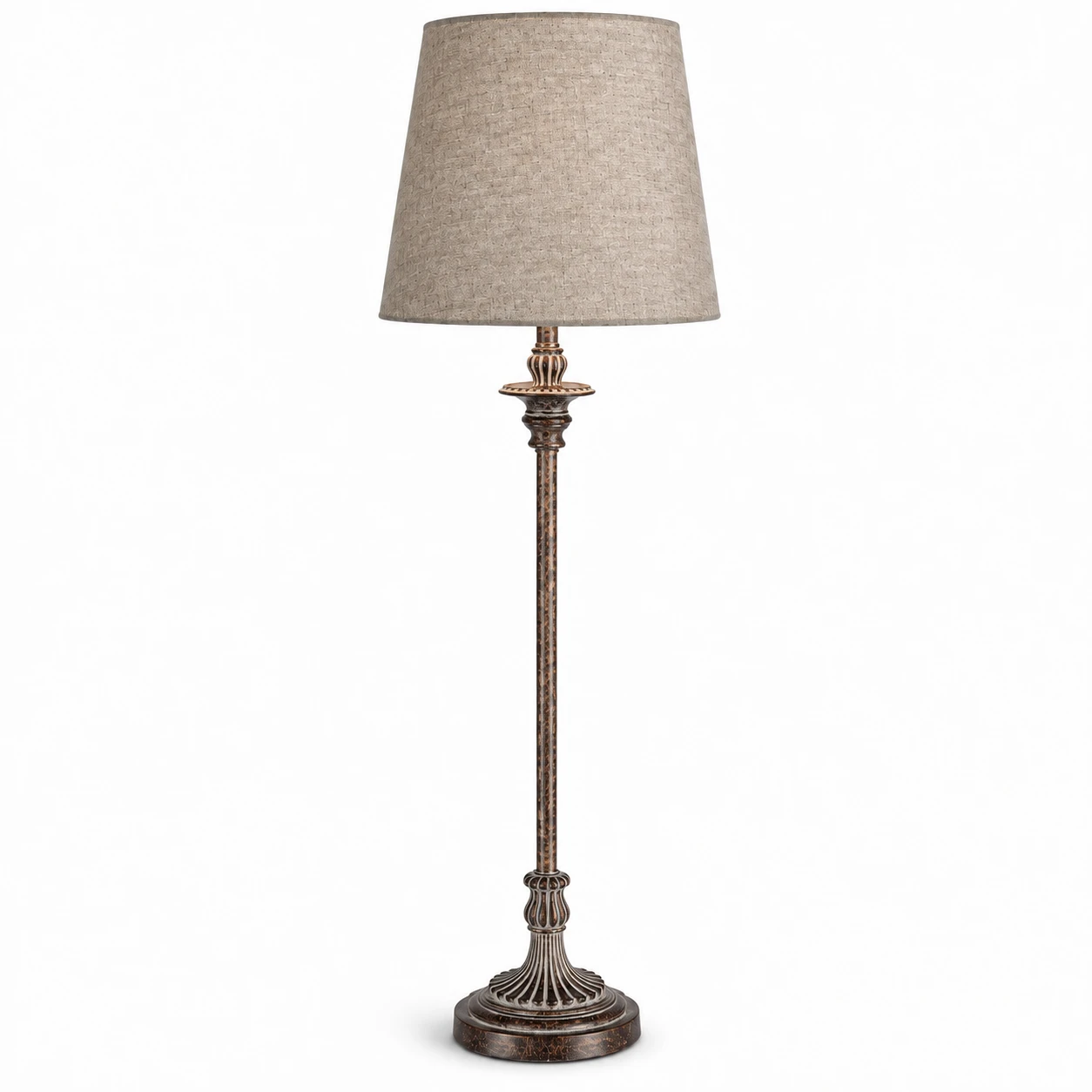 Side-angle view of tall carved wood table lamp on white